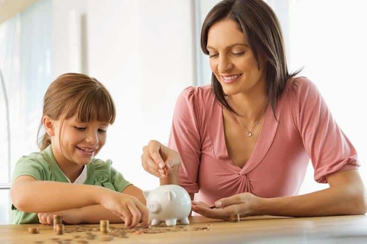 Mother and daughter teaching tax education for kids